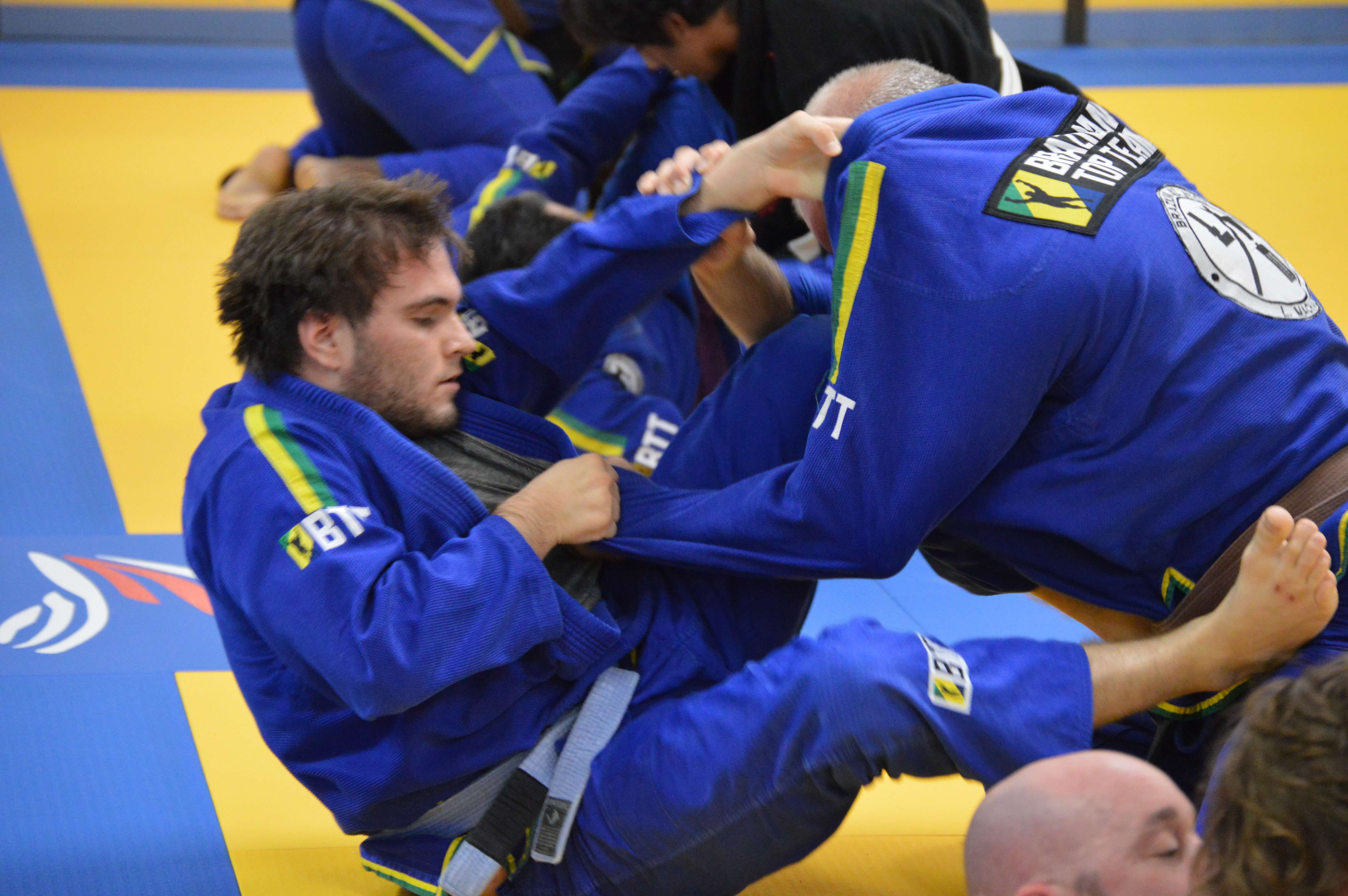 Close-up of BJJ guard technique during training